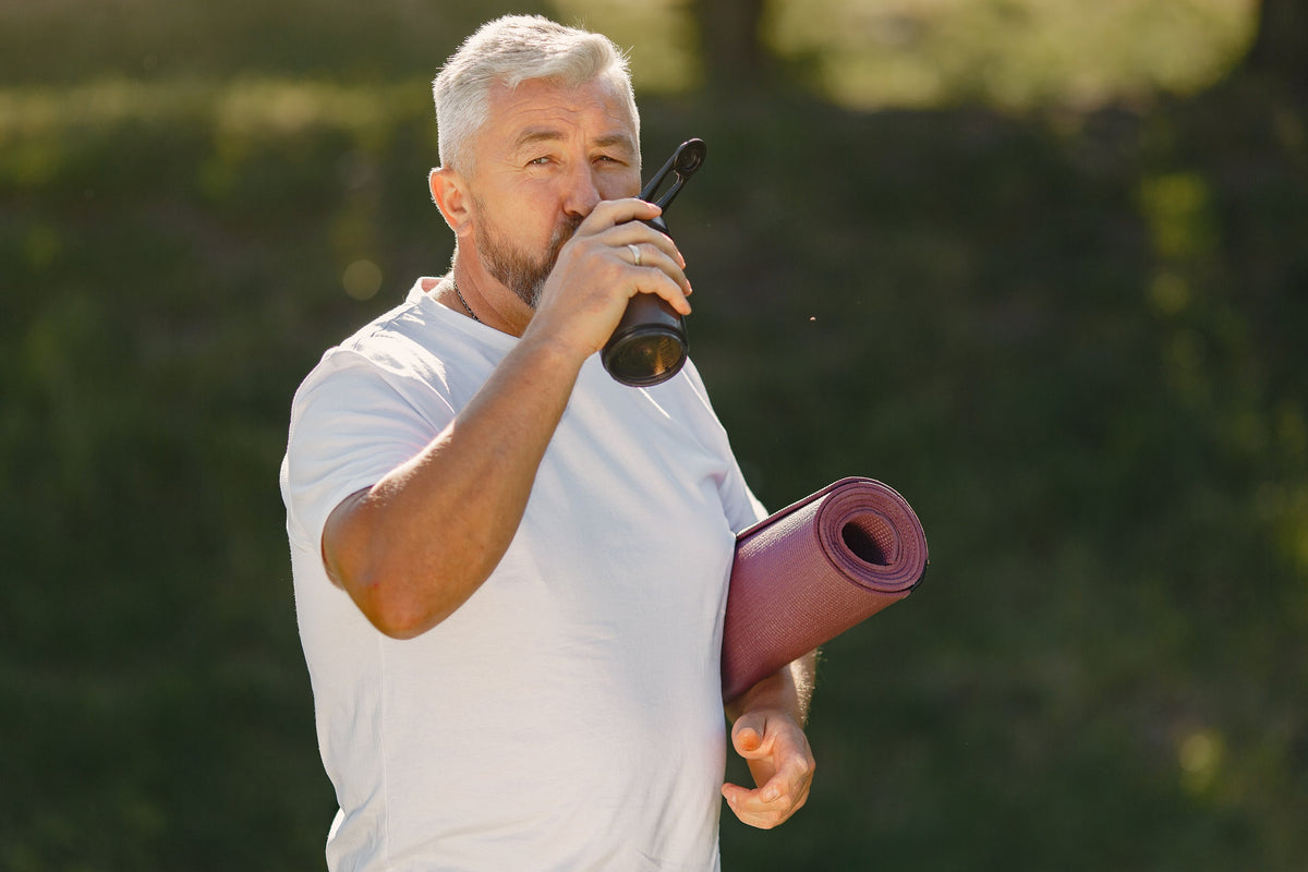 mature-man-training-summer-park-senior-standing-with-mat-old-man-sports-clothes_1